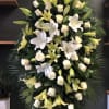 Large standing floral spray with white lilies and cream roses