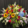 Large mixed bouquet with sunflowers, roses, lilies, hydrangea, and stock