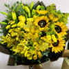 Yellow bouquet with sunflowers, roses, lilies, and orchids