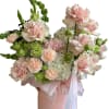 A sweet, airy arrangement in a soft blush + cream palette with