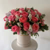 A romantic hat box arrangement featuring premium garden roses in soft shades