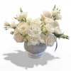 White rose bouquet in a gray pedestal vase