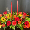 A beautiful candlelit centerpiece featuring rich colors of fall 