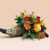 Horn-shaped basket filled with colorful flowers and berries