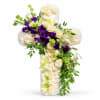 Cross-shaped floral arrangement with white and purple flowers