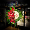 Tropical red anthurium and long stem red rose spray on one side