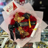24 red long stem roses with with graduation accessories. Please note color