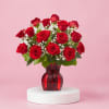 18 roses with babies breath and green. A classic!