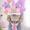 Pastel castle and number 4 balloons with flower-shaped balloons