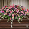 The Calming Memories Casket Spray from FloralFabulous is a peaceful and naturally