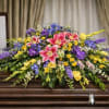 The Restful Garden Casket Spray from FloralFabulous is a beautifully balanced and