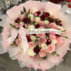 Pink and red rose bouquet with a birthday ribbon and bow