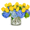 Hydrangea and yellow roses make up this arrangement.