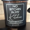 Black soy candle jar with a bold profanity label