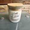 Birthday candle in a glass jar with a bamboo lid
