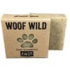 Bar of dog shampoo soap in a kraft box labeled Woof Wild with a paw-shaped cutout