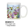 White mug with colorful irises, butterflies, and a hummingbird around the word Love.