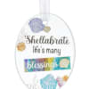 Oval shell ornament with the words "Shellabrate life's many blessings"