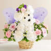 Teddy bear floral arrangement in a basket with purple wings