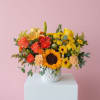 A bright and beautiful mix of yellow and orange flowers, including sunflower