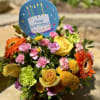 Birthday bouquet with yellow roses, orange gerberas, and pink carnations