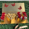 Imagine a gleaming gold gift box, its surface smooth and reflective like