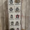 Display rack of assorted dangling earrings on PearTree Jewelry cards