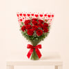 A classic bouquet of one dozen fresh red roses, hand-tied and beautifully
