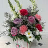 Garden Wishes is a soft and elegant arrangement designed in a charming