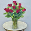 Bouquet of red roses in a clear glass vase