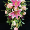 Bridal bouquet with pink lilies and pale roses