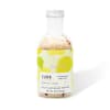Bottle of jasmine tea and ginger bath soak with a colorful label