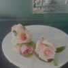 Typically worn on a lapel, it consists of a single rose bud.