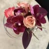 Choosing between a gold or silver cuff for a corsage depends on