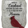 Decorative stone plaque with a red cardinal and memorial text
