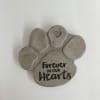 Gray paw print plaque with the words "Forever in our Hearts"