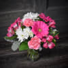 Pink and white mixed bouquet in a clear glass vase