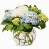 Fresh, lush, and effortlessly elegant, this stunning arrangement features white and soft