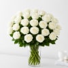 Elegant and timeless, this stunning arrangement of premium white roses is beautifully