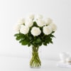 Elegant and timeless, this stunning arrangement of premium white roses is beautifully