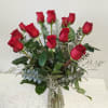 Bouquet of red roses in a clear glass vase