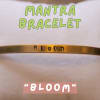 Gold bracelet engraved with the word Bloom