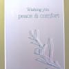 Sympathy greeting card with 'Wishing you peace & comfort' text and simple leaf line art on a soft gray background