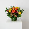 A radiant cluster of warm tones-vivid orange and sunny yellow roses, fiery