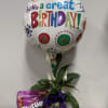 Birthday balloon with a potted plant and candy bag
