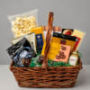 Gift basket filled with popcorn, pretzels, and packaged snacks