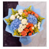 Bouquet of blue hydrangeas, white and orange roses, and yellow filler flowers
