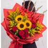 Bouquet of red roses and yellow sunflowers wrapped in red paper