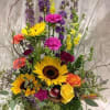 Tall mixed bouquet with sunflowers, roses, and purple blooms