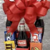 Gift basket with Coca-Cola bottles, candy bars, and a large red bow